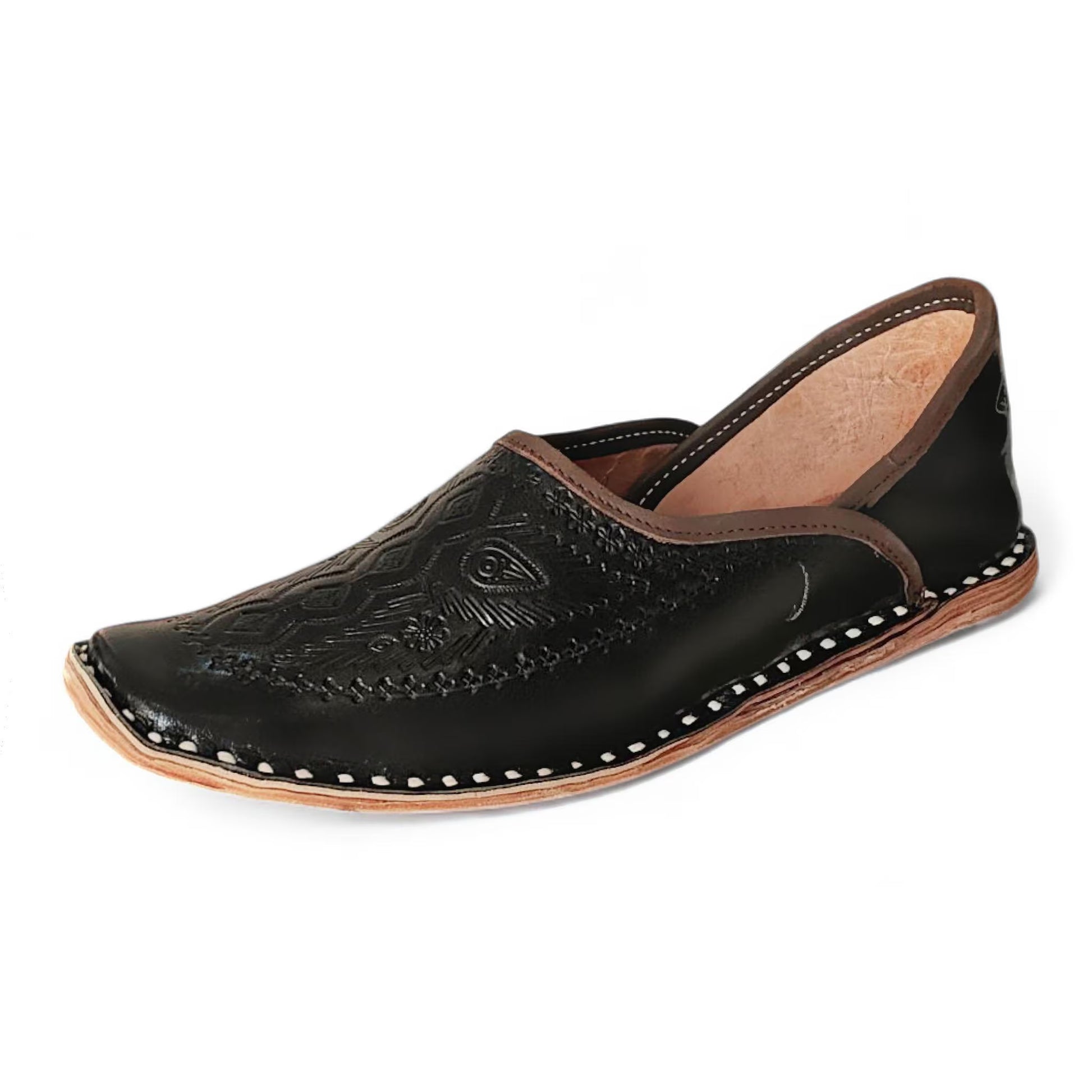 A single black leather Moroccan jodhpuri mojari slip-on shoe with hand-stitched detailing, decorative embossed patterns on the toe, and contrast stitching, shown against a plain white background.